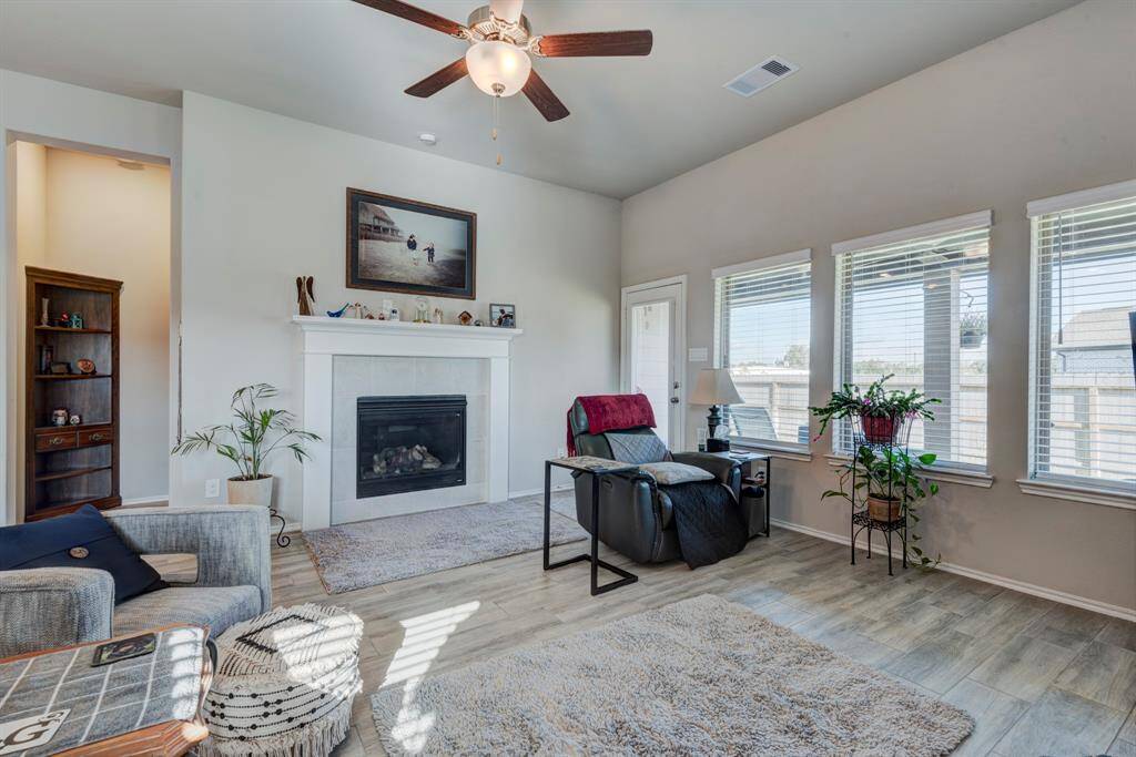 Please notice all the natural lighting and a view to the covered back porch.