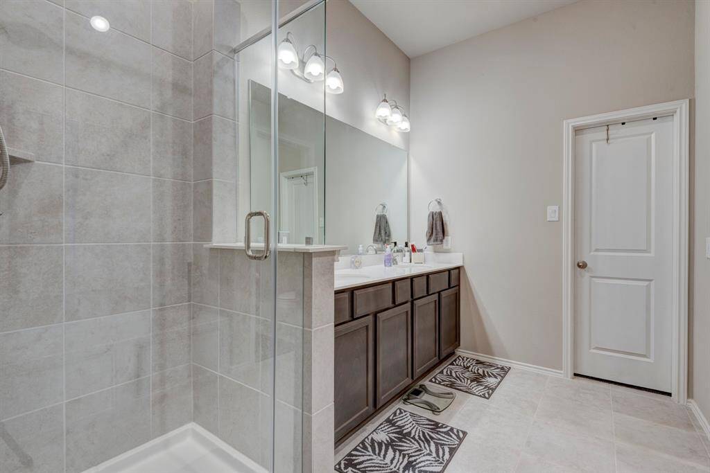 Primary bath has separate jacuzzi tub and shower, double sinks and walk in closet.