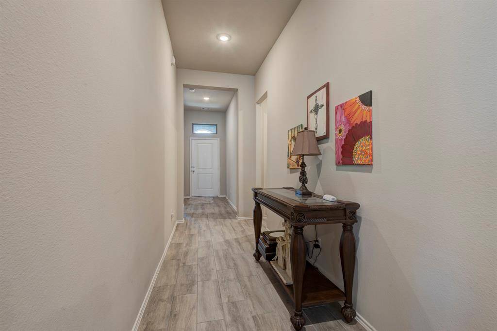 Long entry way.  The hallway to the right is leading to the garage and utility room.