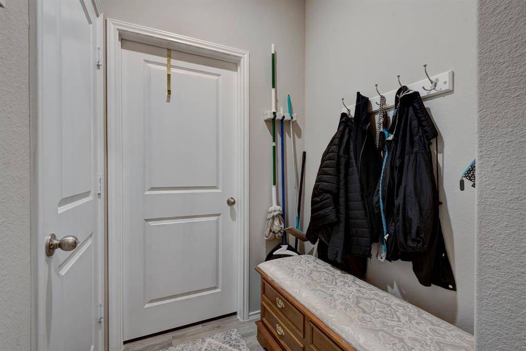 Garage is to the left and utility room is straight ahead.