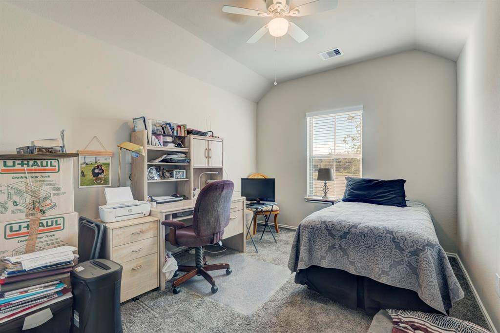 Bedroom 3 is located at the front of the home and has a view of the front yard.