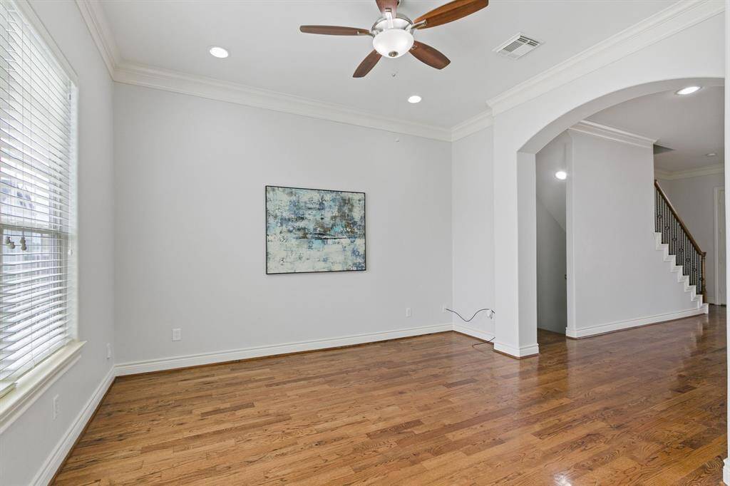 Great view of huge living or breakfast area with wonderful windows for natural light and wonderful hardwood floors.