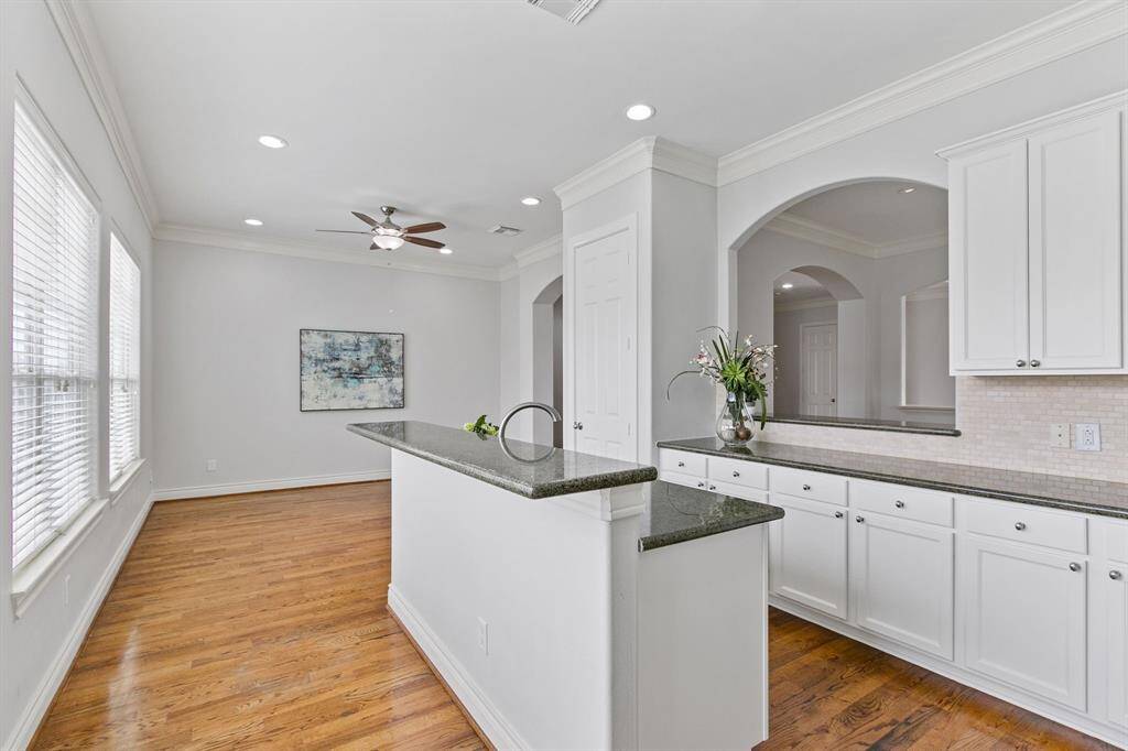 Gourmet island kitchen has granite countertops, breakfast bar and open to huge living or breakfast area.