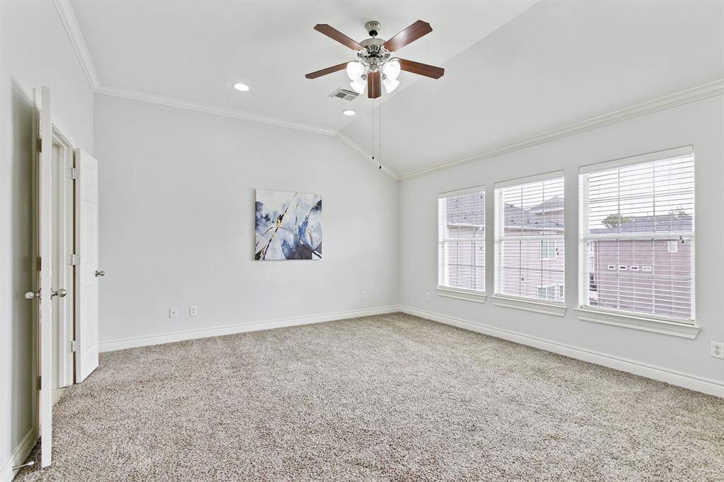 Fabulous owner's suite on the top floor is freshly painted and has high ceiling, recent carpet, ceiling fan and lots of windows.