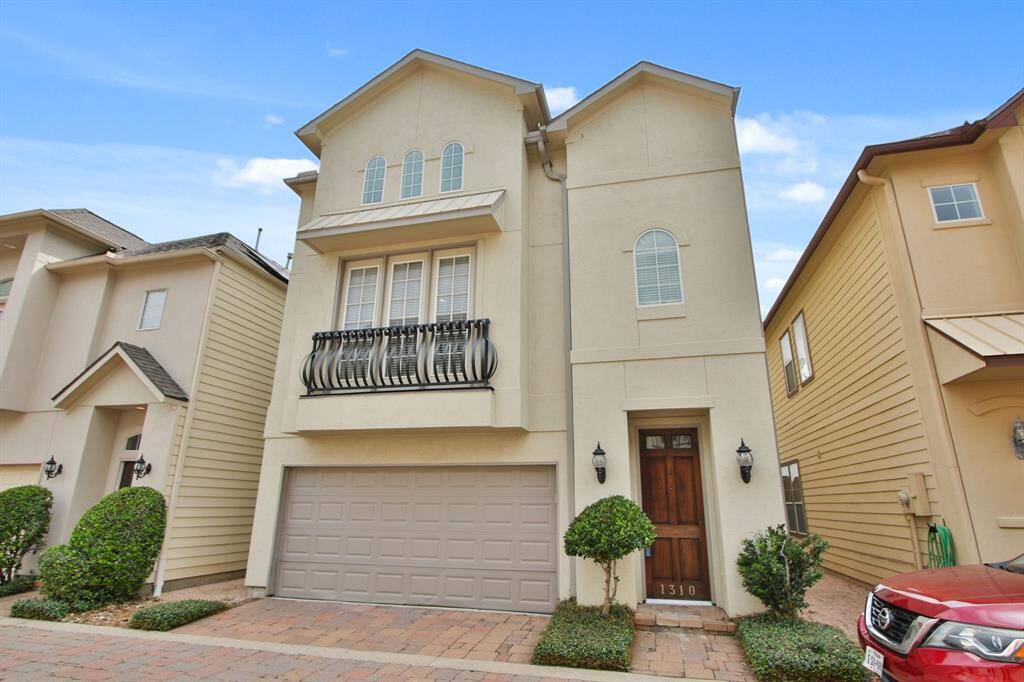 MOVE IN READY! BEAUTIFUL three-story home in Spring Branch GATED community MINUTES from City Centre known for Shops, Cafes and Fun PLUS easy access to Major Highways.