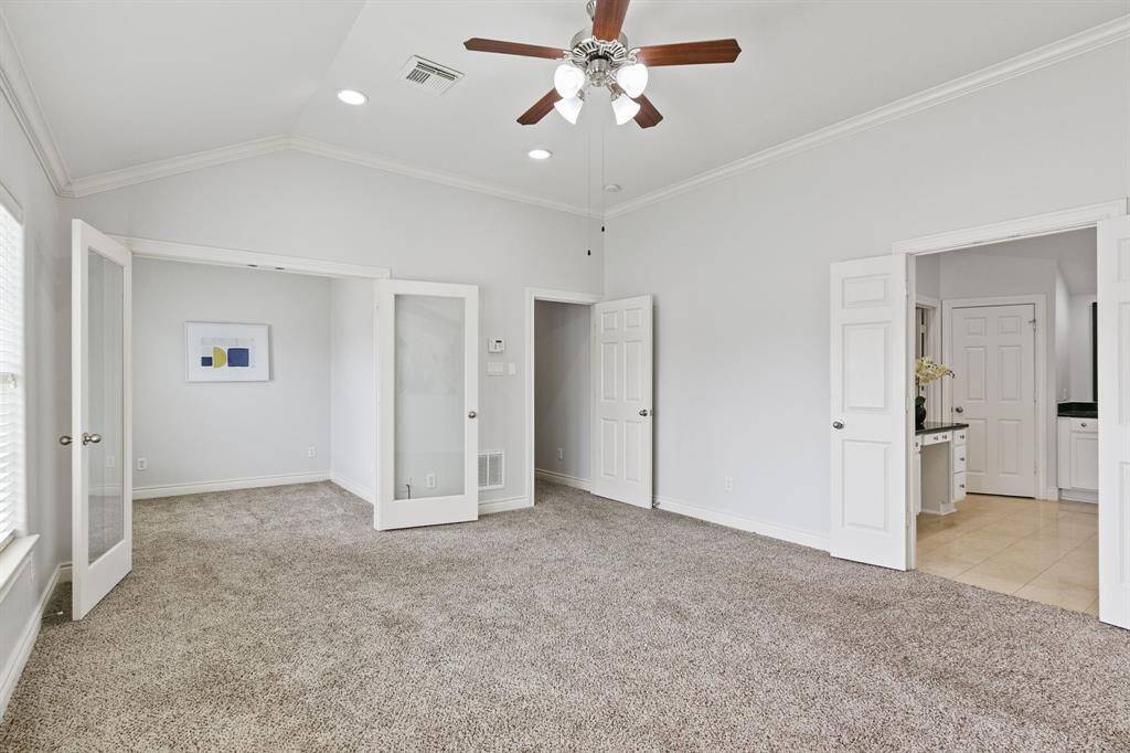 View of fabulous owner's suite has private full bathroom and an extra room through French doors perfect for an office, flex room or nursery.