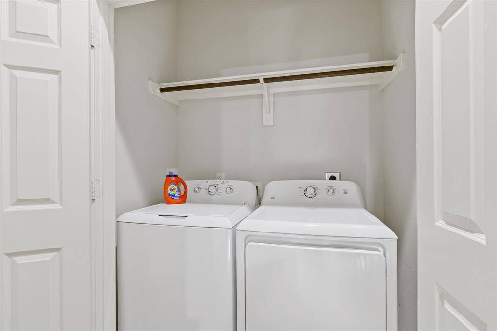 The washer and dryer are conveniently located on the top level.