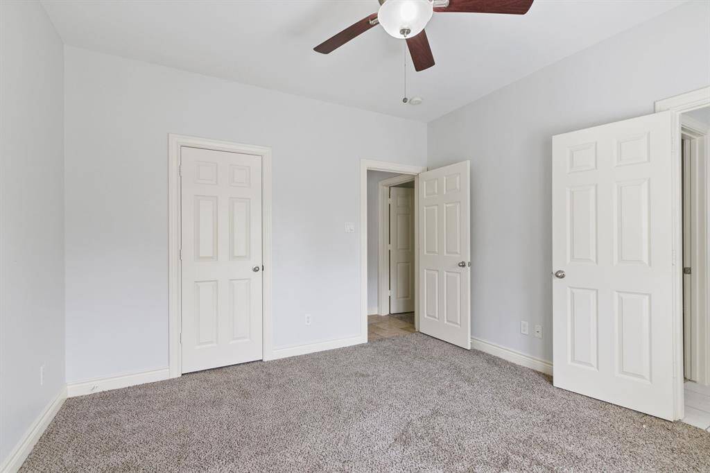 Another nice secondary bedroom on the first floor with fresh paint, recent carpet and ceiling fan.