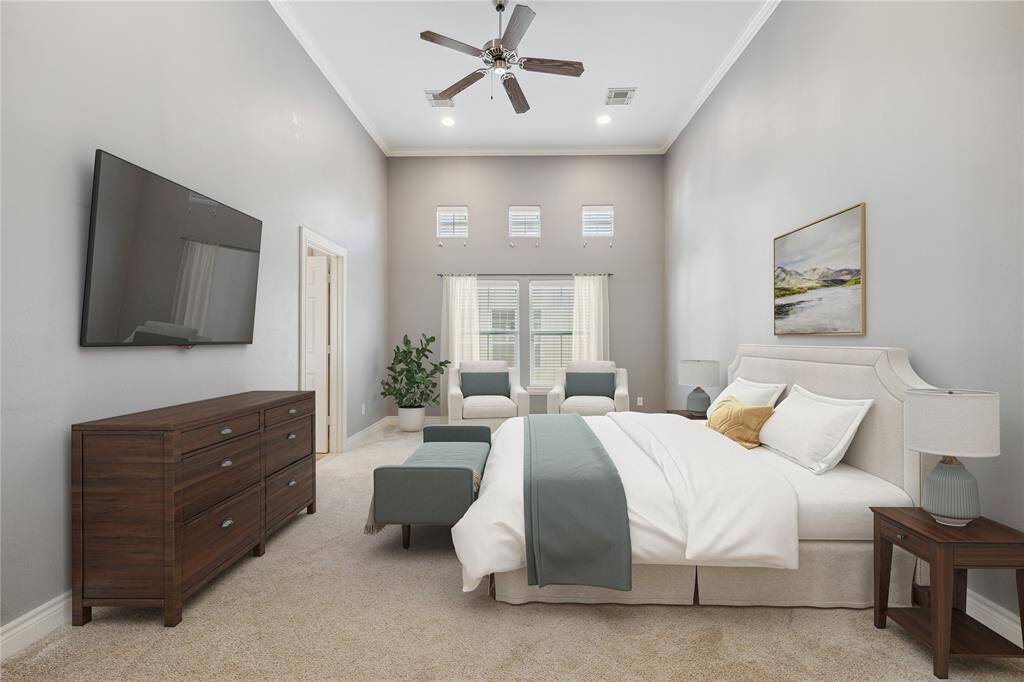 Second floor primary bedroom with soaring high ceilings. Spacious and relaxing with tons of natural light. New carpeting throughout! (virtually staged)