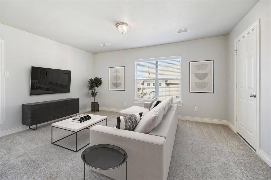 Third floor secondary bedroom is very private and has its own bathroom. This could double as a flex space for a game room, office or whatever you may need. (virtually staged)