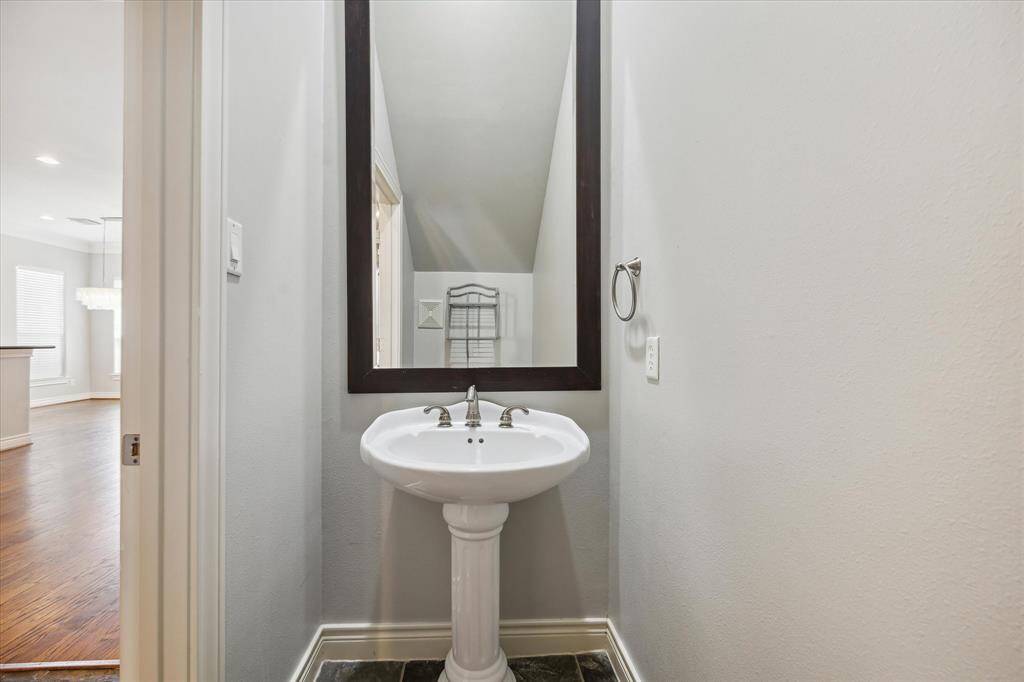 The powder room is conveniently located on the first floor down the hall.