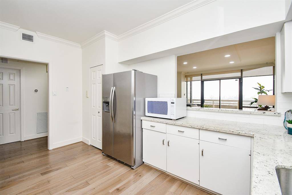 There's no shortage of storage, in this kitchen! Enjoy the added convenience of a spacious pantry for extra storage.