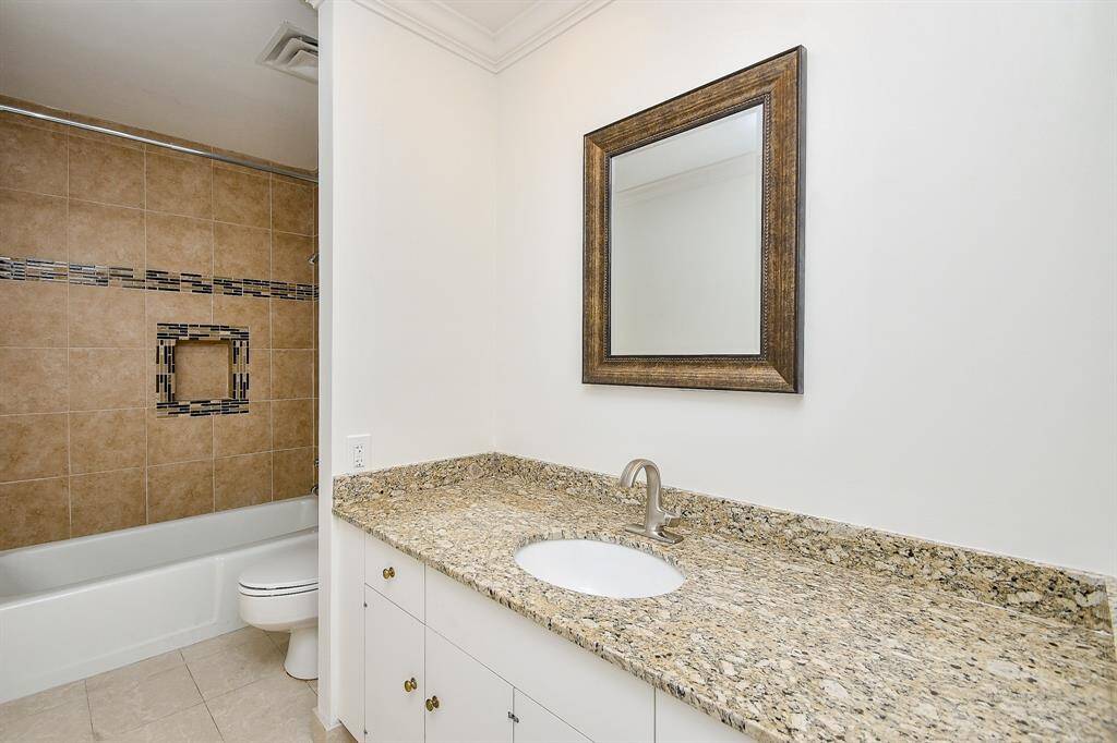 The full secondary bath, also recently remodeled, features a bath/shower combo with modern finishes, offering both style and functionality.
