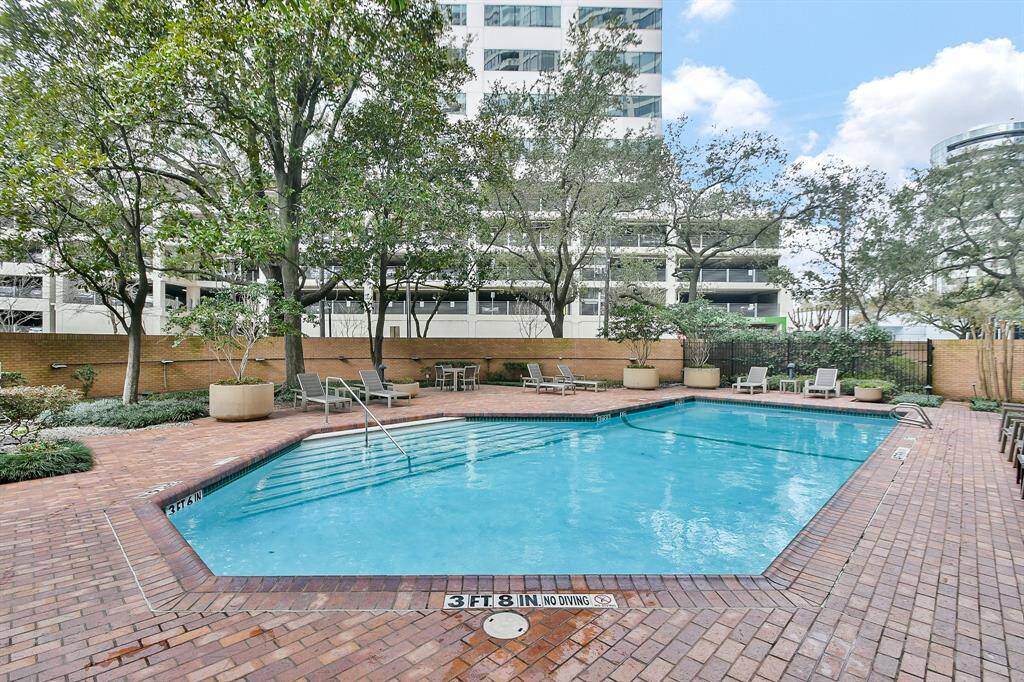 Relax and unwind at one of the two heated pools on the property, exclusively for residents. The pool area is framed by lush, mature trees, creating an intimate and serene retreat for ultimate relaxation.