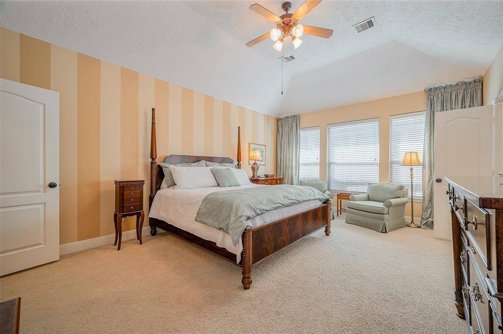 Large primary bedroom located on the first floor, includes a nice sitting area.