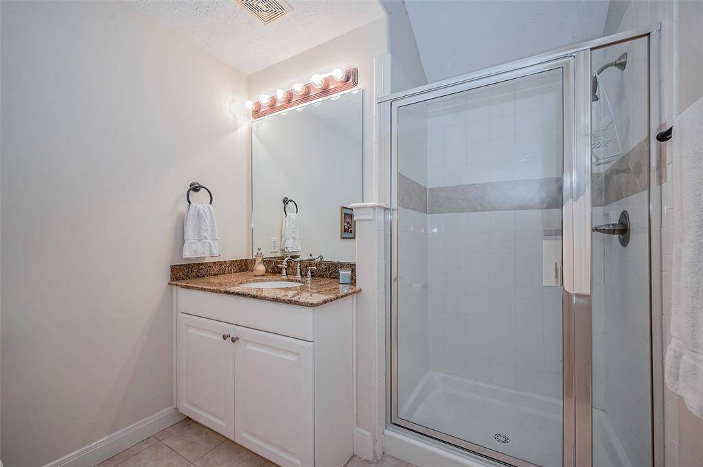 Ensuite bathroom with stand alone shower.