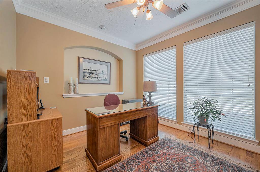 Home office conveniently located to the right of the front door includes French doors for privacy.