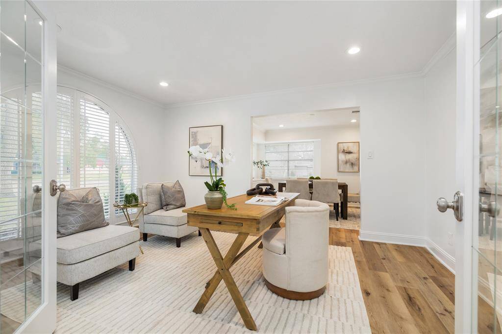 Double French doors open to this spacious office space. You can close the doors for privacy or create a second living area here.