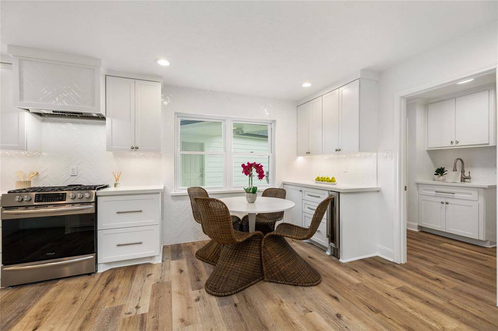 Breakfast nook is the perfect place to gather for a quick meal - bonus storage in this serving nook - and check out more storage/sink in the laundry room.