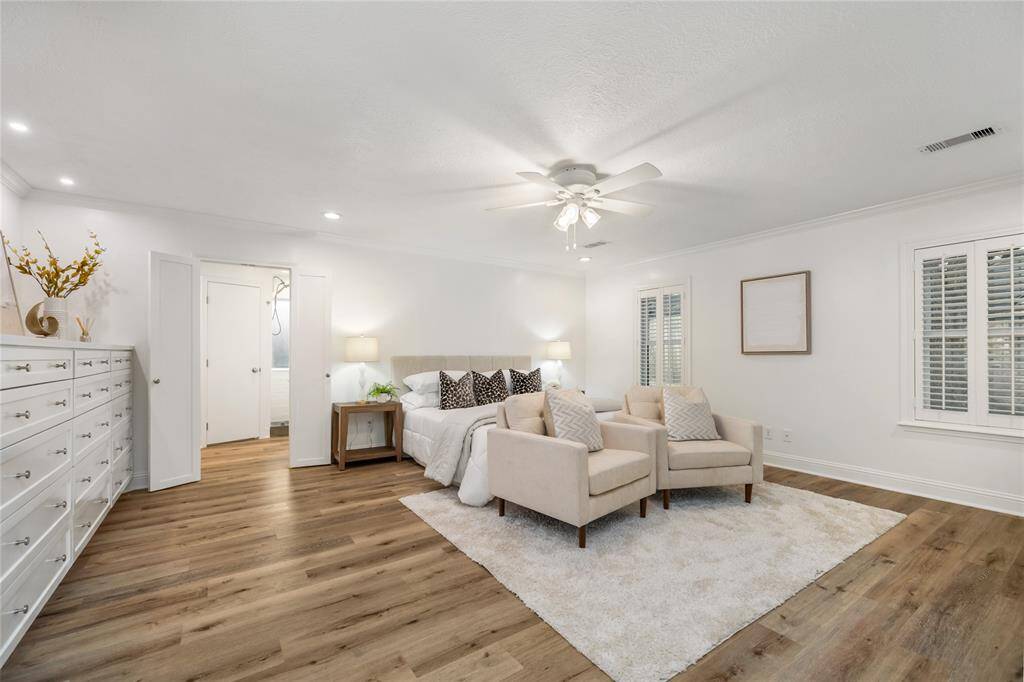 Down the hall you will find this spacious primary bedroom with SO much room!