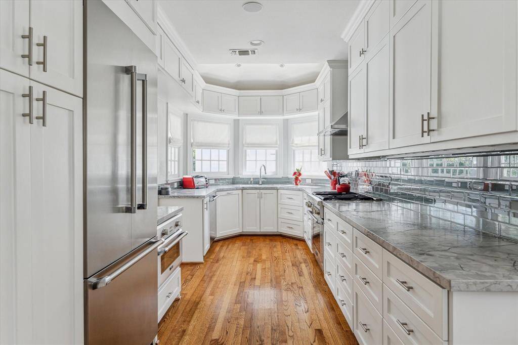 The kitchen has been beautifully renovated.  Great views of the backyard gardens and pool.