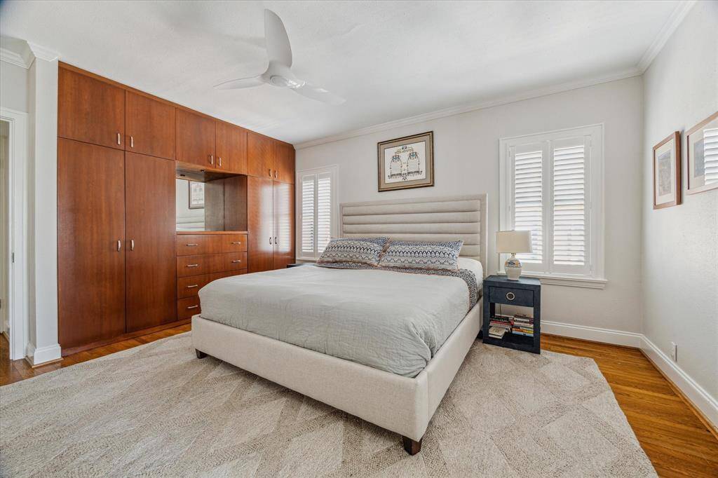 The primary bedroom has beautiful built-in cabinets.