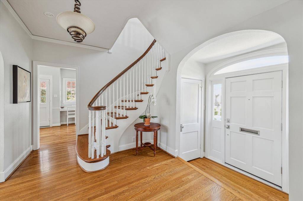 Lovely entry hall and beautiful staircase.