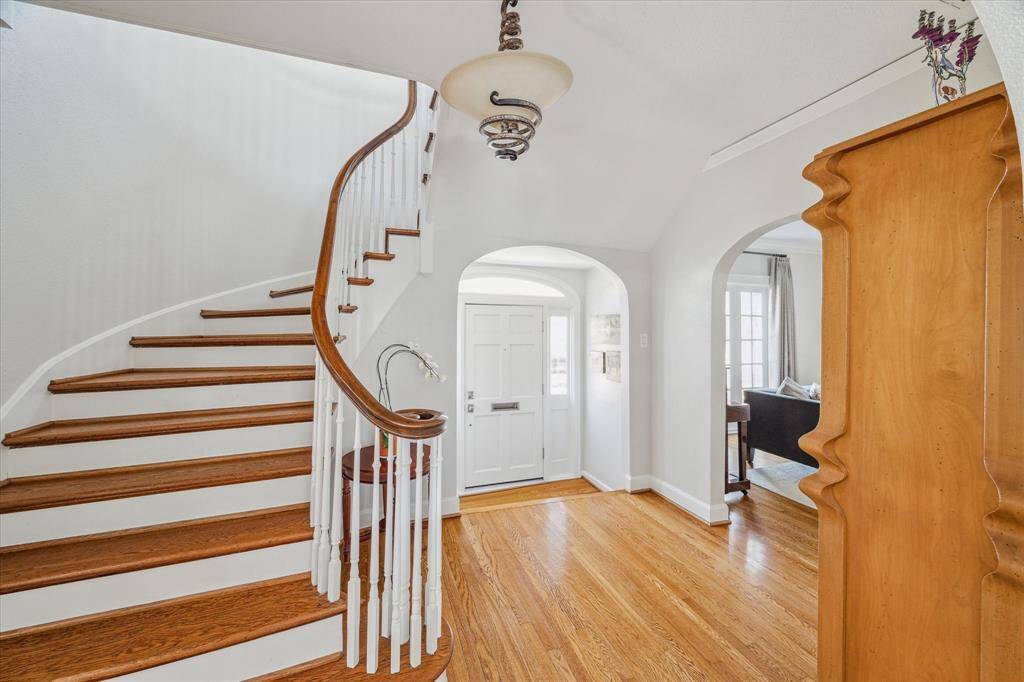 Beautiful hardwood flooring, plaster walls and a very cool entry hall light fixture.