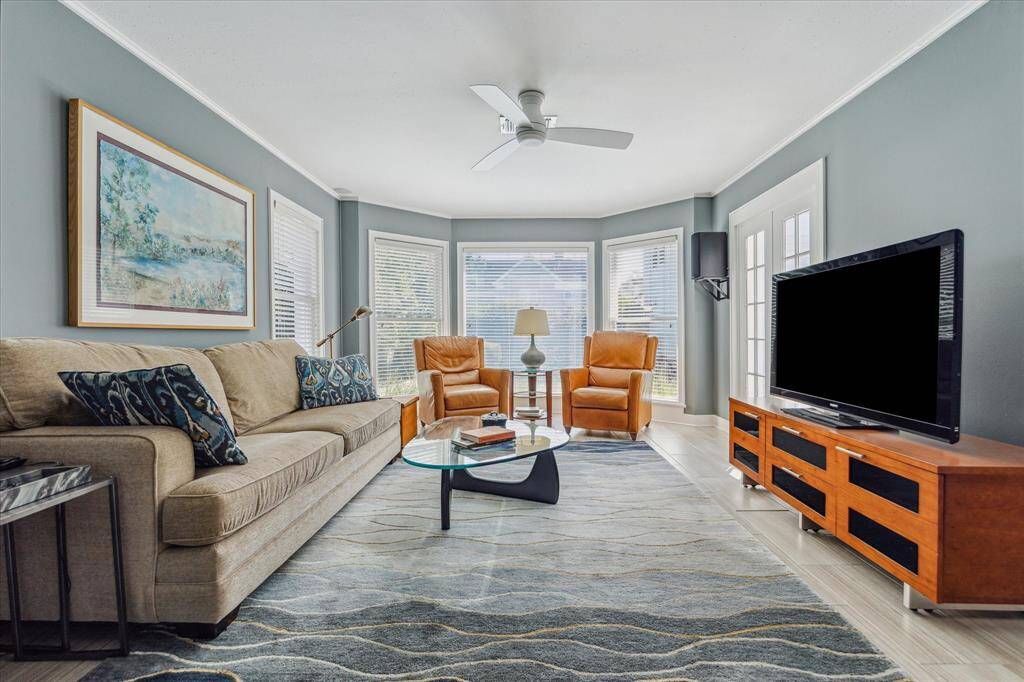 Den/family room with an abundance of natural light.  Views to the backyard gardens and pool.