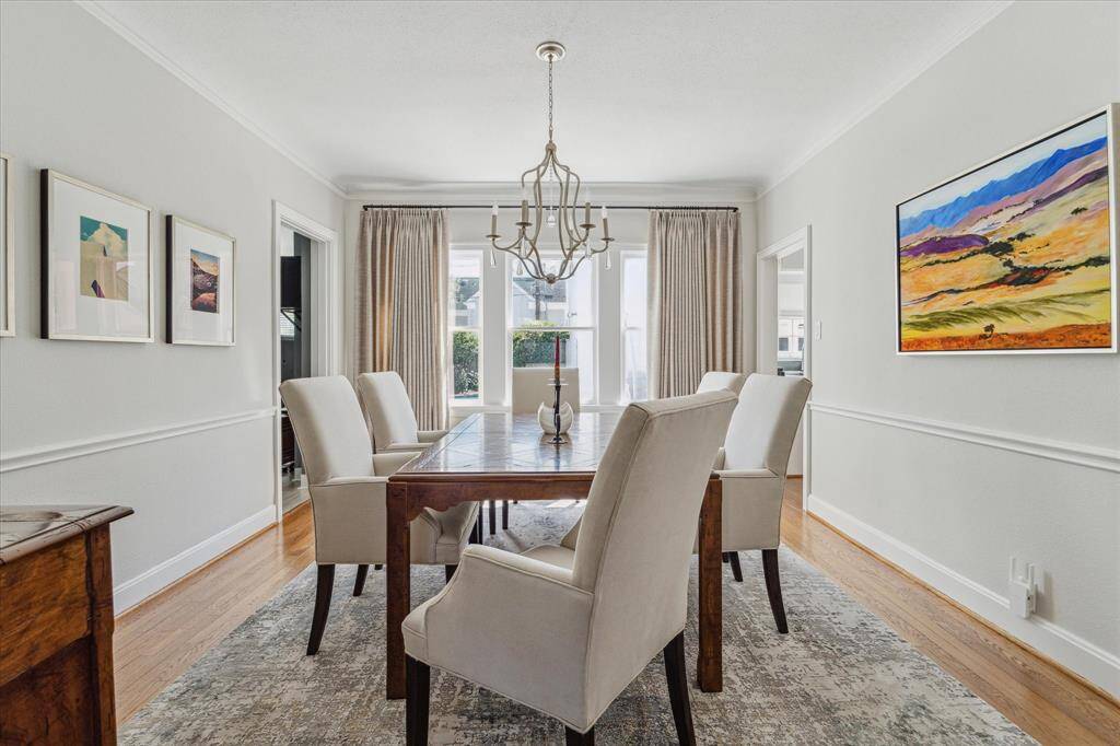 The dining room  also has views to the backyard gardens and pool.