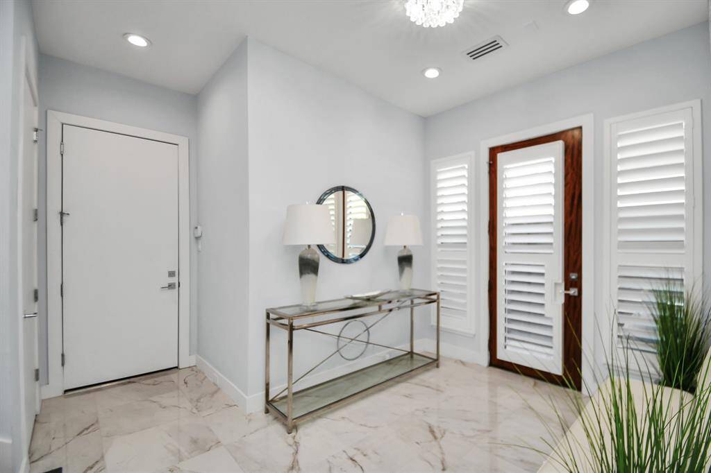 Foyer connects to Elevator Shaft and Garage Door