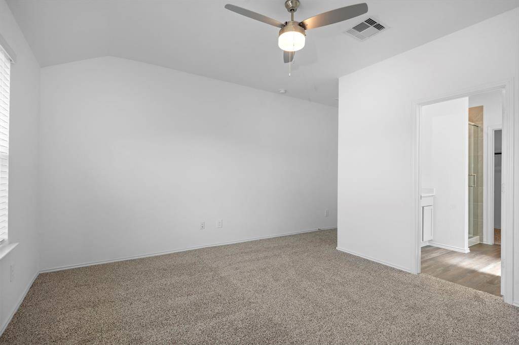 This generous primary suite is so spacious layout includes a cozy nook that can be used for a reading space, small office setup, or extra storage.