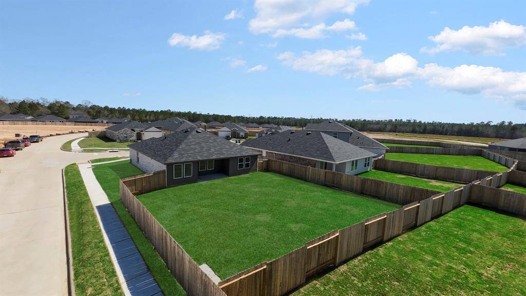 This home sits on a generous lot with a fully fenced backyard, providing privacy and ample space for outdoor activities.