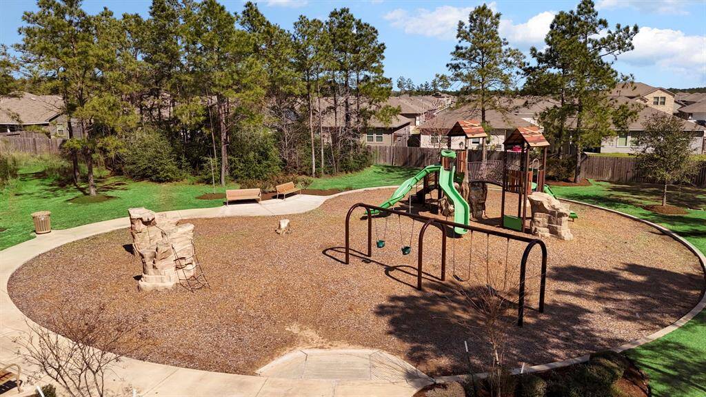 A fantastic outdoor play area with swings, slides, and climbing structures—ideal for children to explore and enjoy.