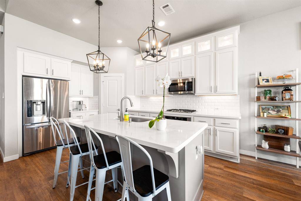 Any chef's dream, this stunning kitchen is perfect for everyday life as well as entertaining family and friends! Extra large kitchen island is perfect for conversation or that much needed space to lay out your party spread for everyone to enjoy! Large windows provide lovely views of your backyard and plenty of natural lighting throughout the day.