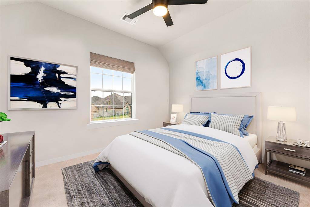 Retreat to this bright and inviting secondary bedroom, featuring high ceilings, a modern ceiling fan, and ample natural light—creating a comfortable space that feels like home. *Virtually Staged