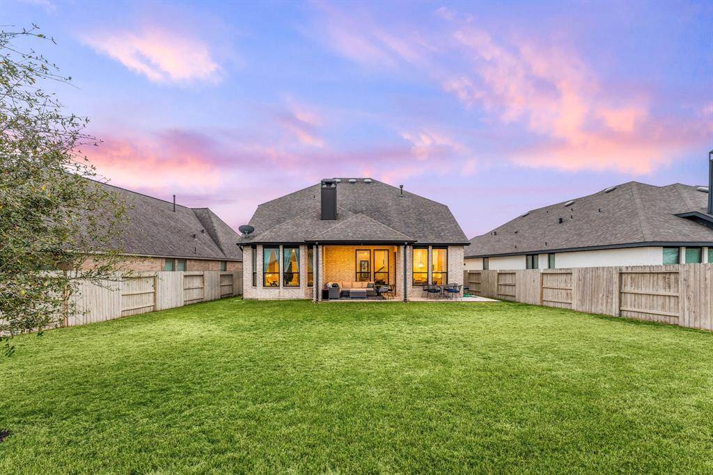 Delight in serene sunset views from this expansive backyard, complete with a fully fenced perimeter for added privacy.
