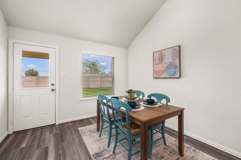 The eat-in kitchen offers a dining area large enough to comfortably accommodate 4-8 people.
