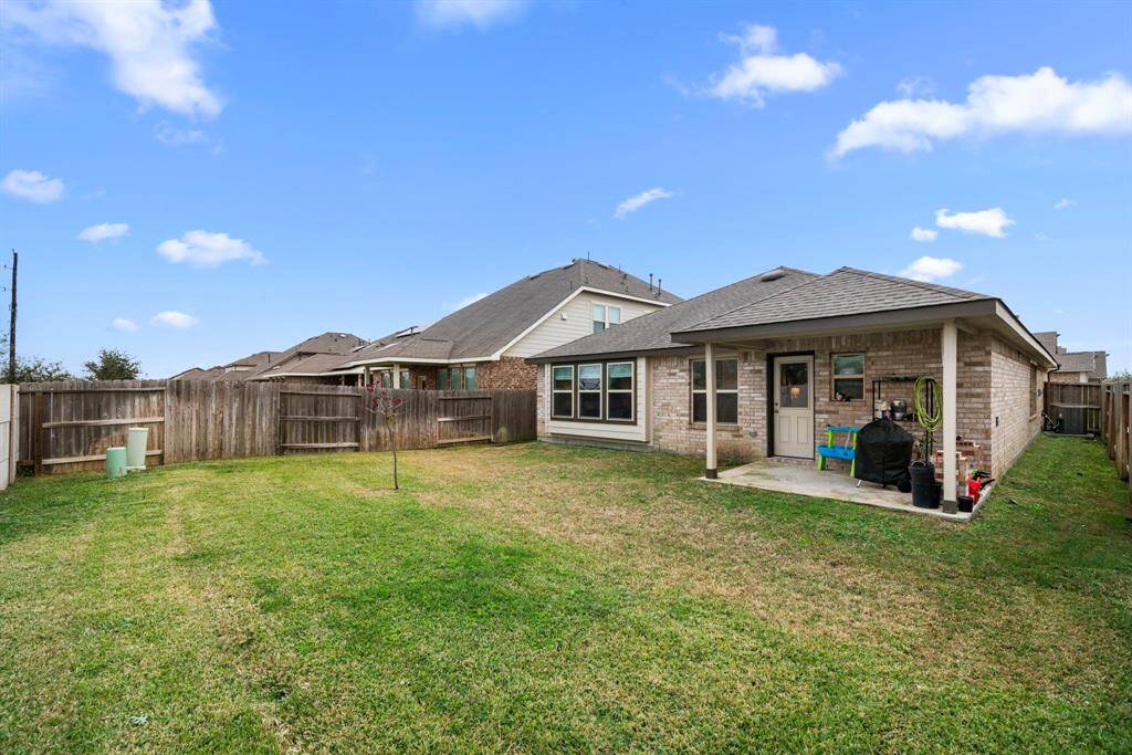 Take a look at the generously sized backyard, offering both a covered patio and plenty of space for pets and the family to enjoy.