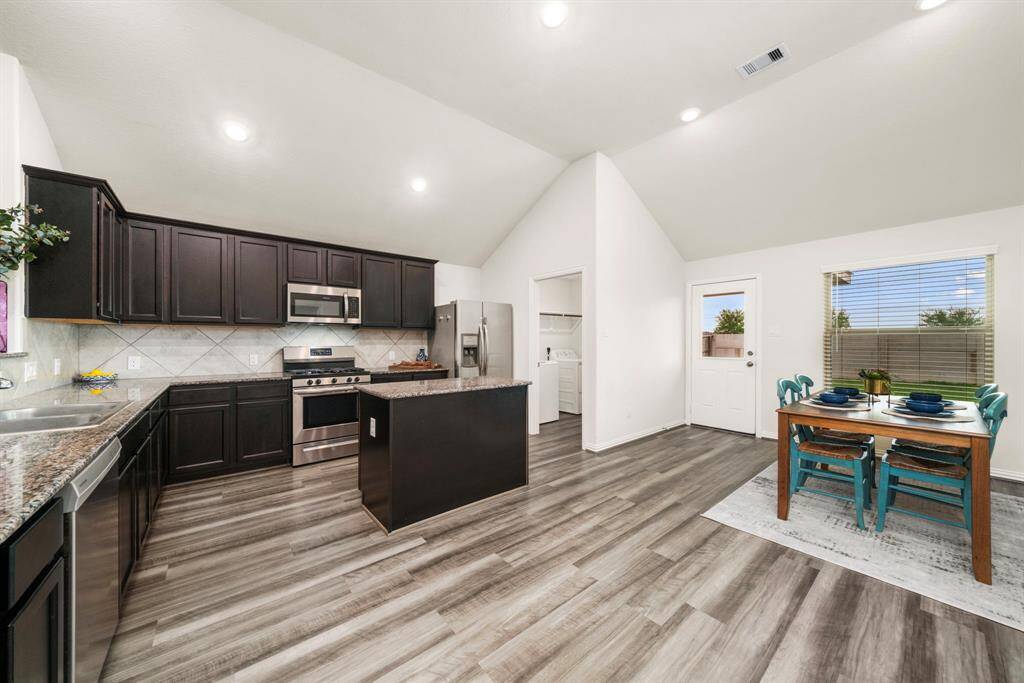 Dining area off the kitchen with views into the backyard.