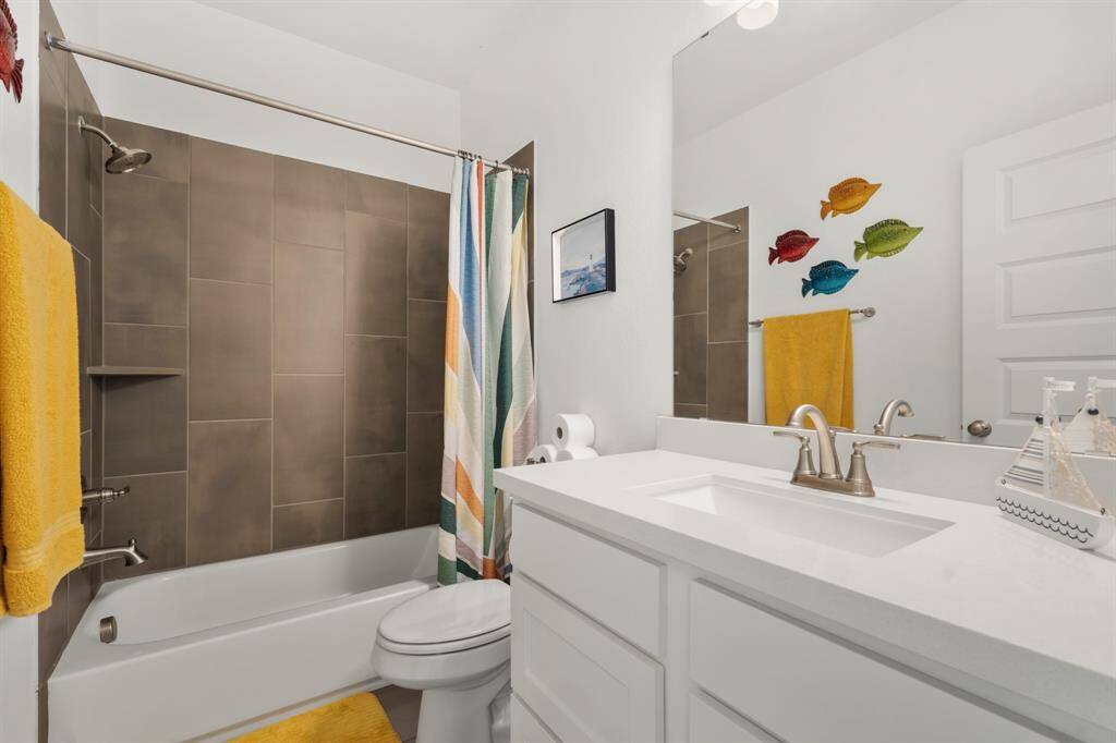 Secondary bath 1 upstairs adjacent to gameroom