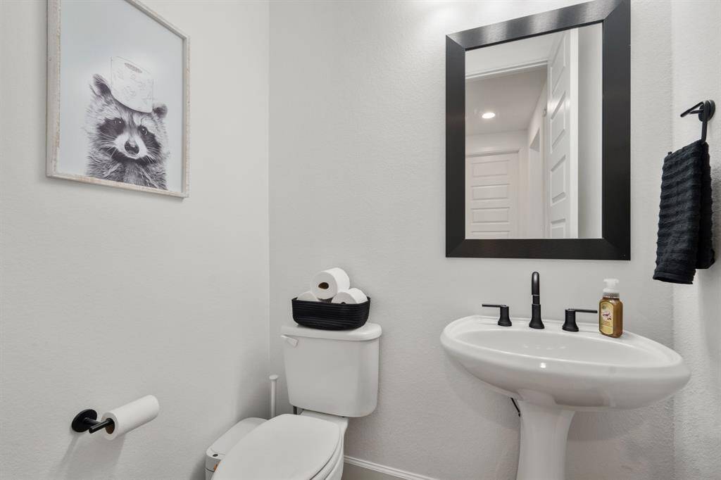 Half Bath on first floor near utility room.