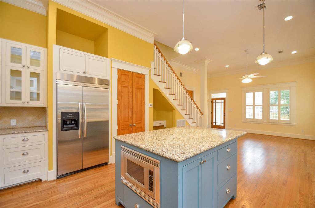 View of the kitchen and the open floor plan den/family area.