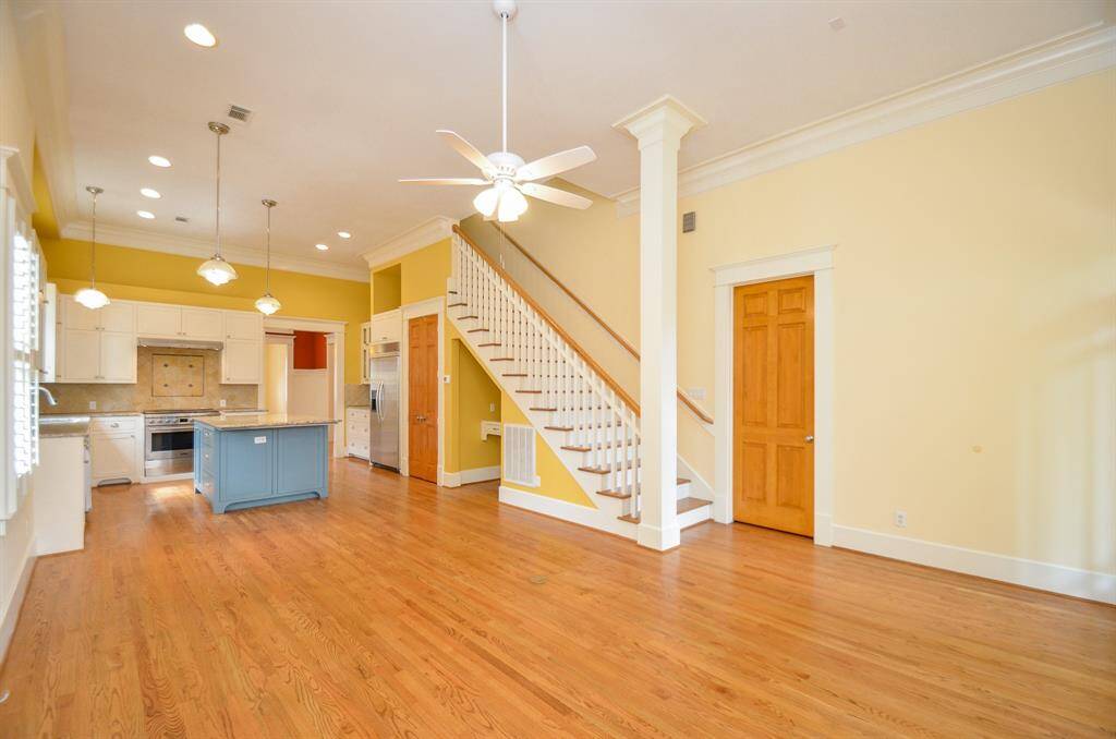 View of the den area and the stairs to upstairs play room and 2 bedrooms and 1 bath.