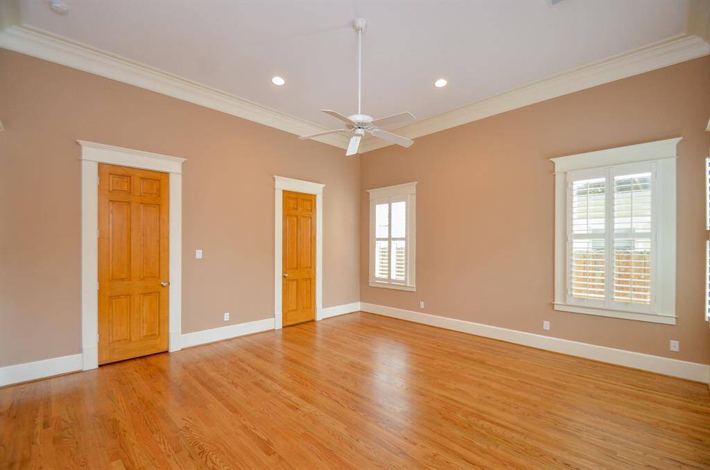 Principal bedroom with doors to bath and closet.