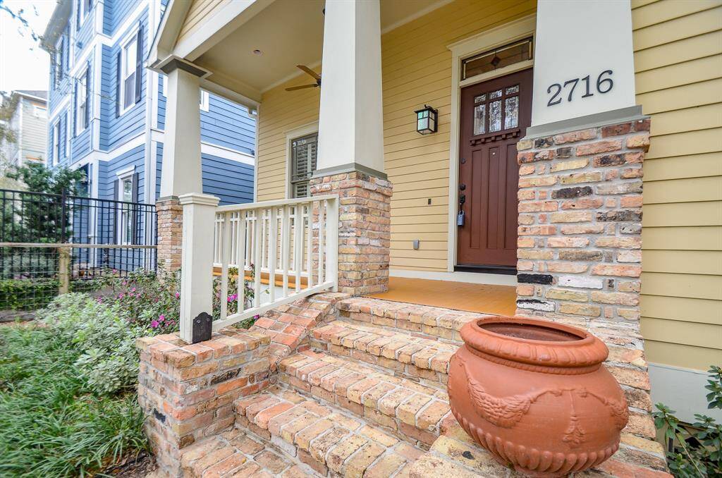 Entry with brick stairs to front porch.
