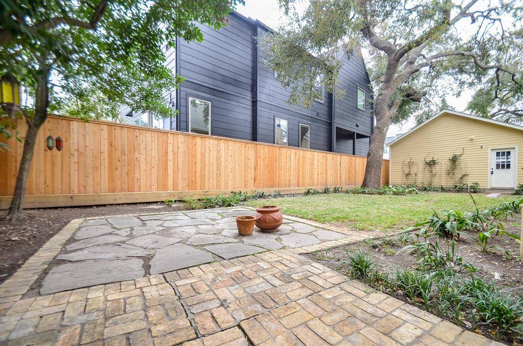 Large backyard area with room for outdoor furniture.