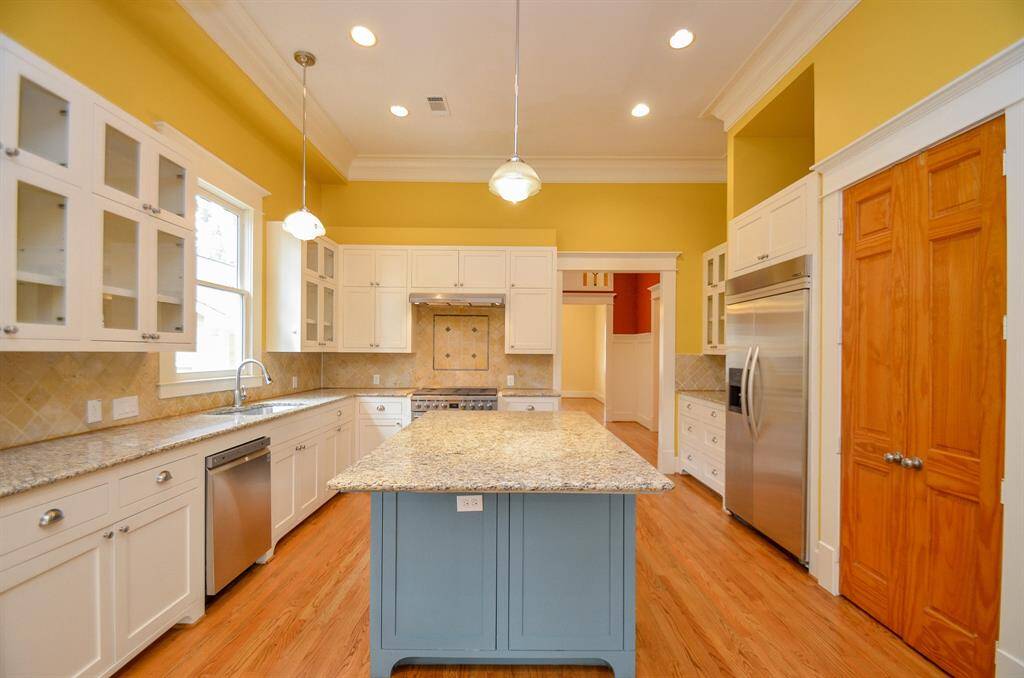 Kitchen with island and pantry.