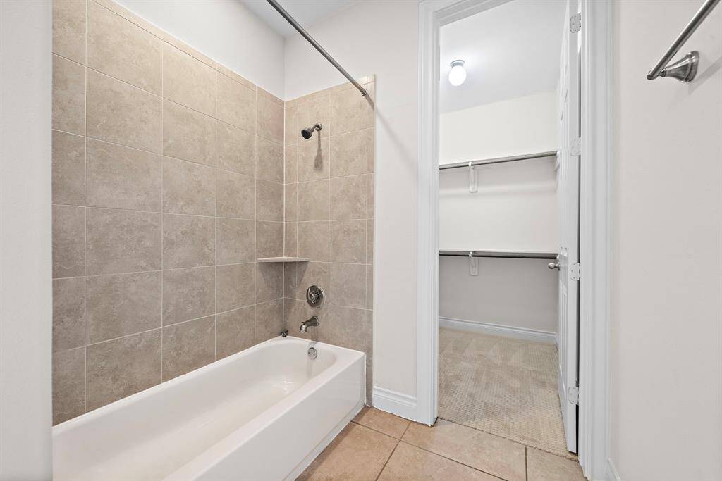Inviting bath with a soothing tub.