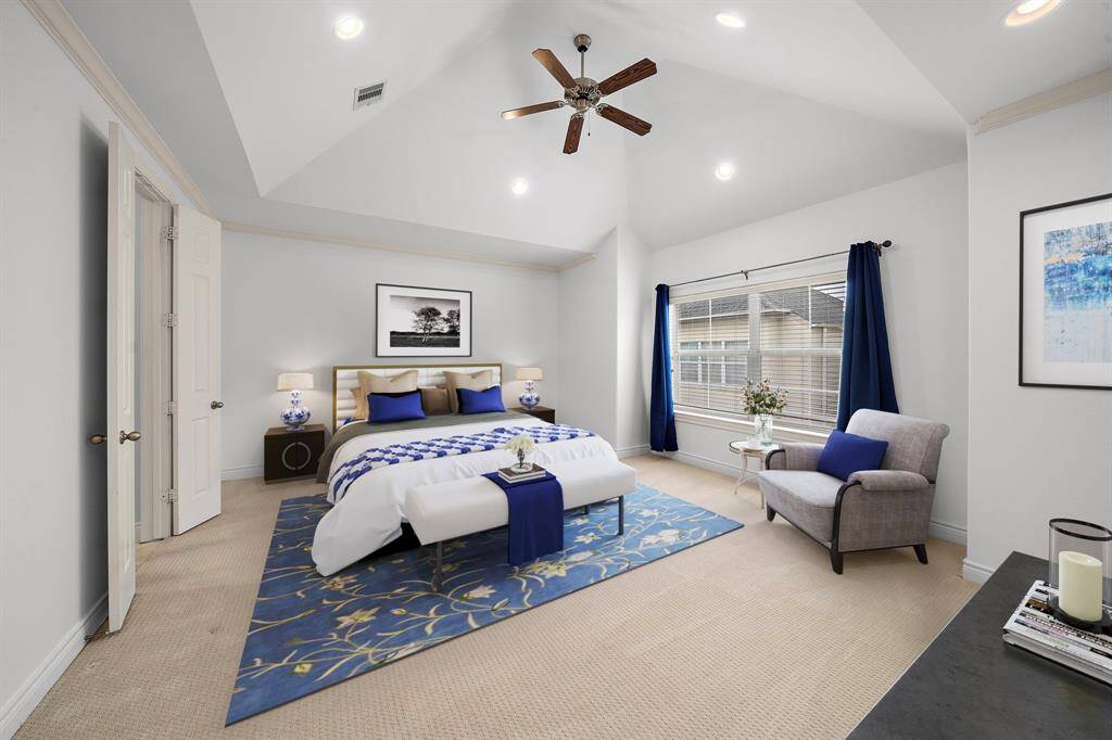 staged primary Bedroom adorned with astunning ceiling and a spa-like bathexuding beauty and tranquility